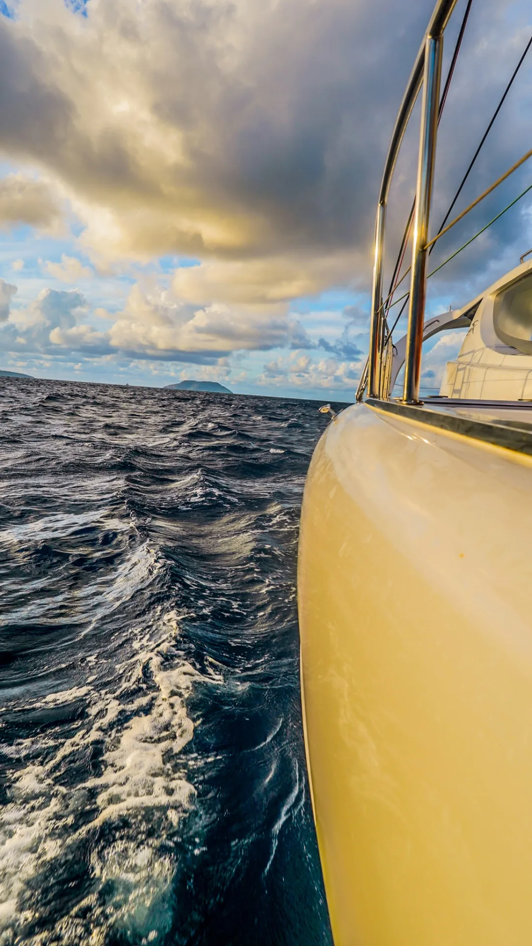 Sailing past a Virgin Island from the bow of Stella Blue